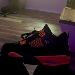 Black in yellow Jordan 4s